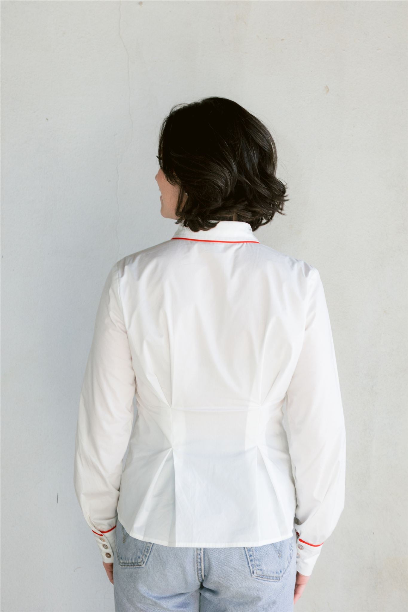 white blouse with red embroidery